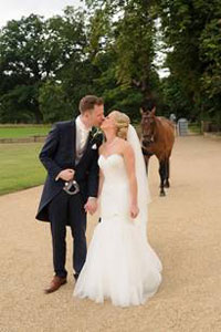 bride and groom with horse