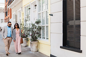 Radhika & You walking down colourful street wedding planning