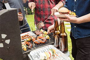 Stag and hen parties - men at a bbq