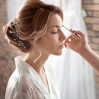 Bride having makeup done