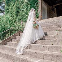 Bride walking up stairs