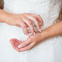 Bride spraying wedding fragrance 